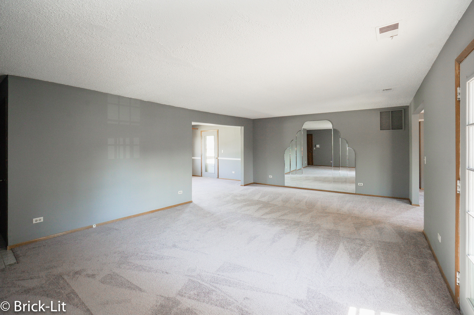 19444 Wolf Road, Unit 3 Mokena, IL 60448 - Photo 7 of 18 a view of empty room with window and wooden floor