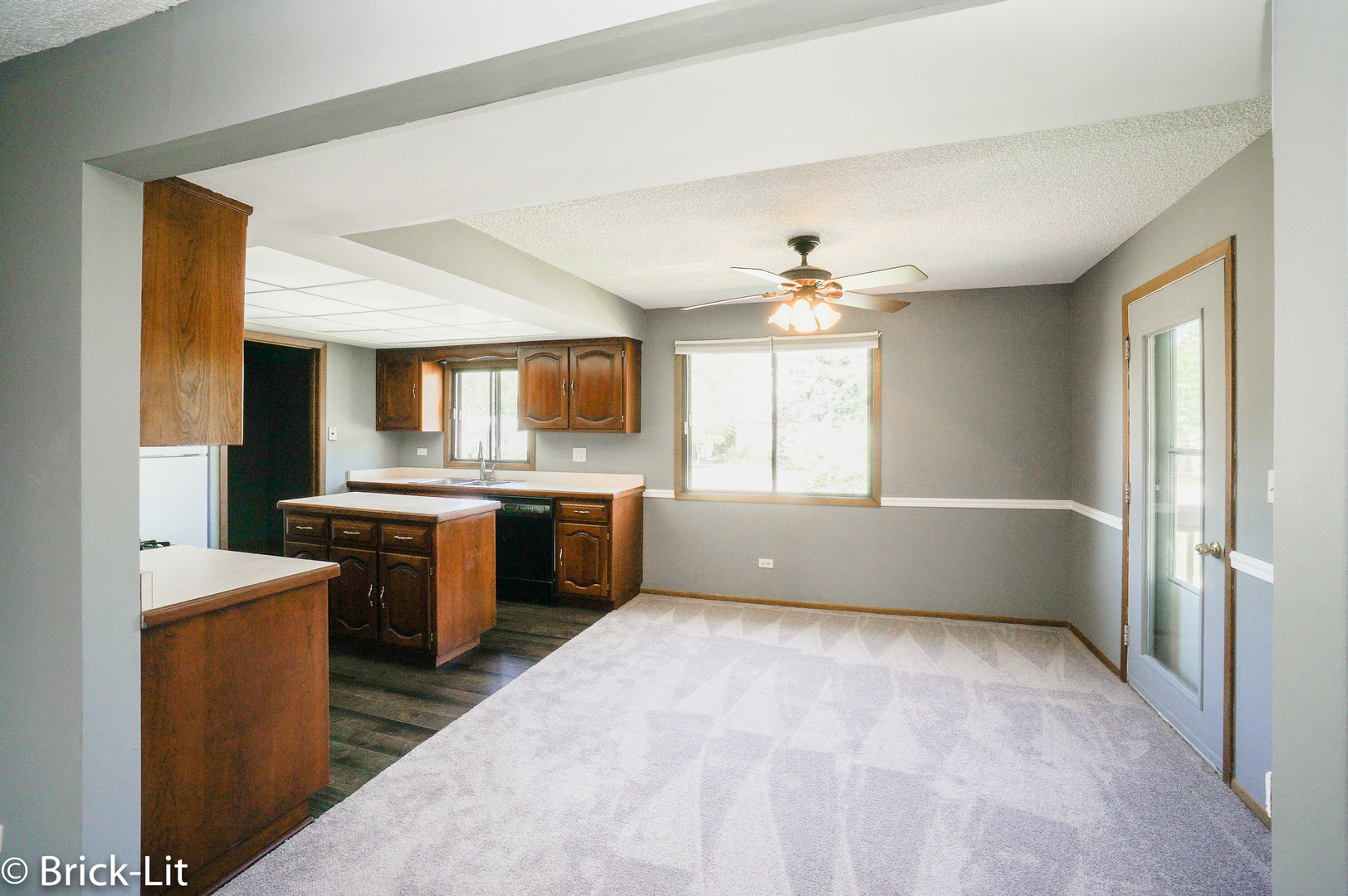 19444 Wolf Road, Unit 3 Mokena, IL 60448 - Photo 10 of 18 a view of a kitchen with a sink dishwasher and a fireplace