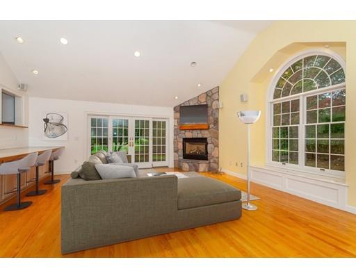28 Constitution Road Lexington, MA 02421 - Photo 1 of 25 a living room with a couch and a large window