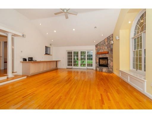 28 Constitution Road Lexington, MA 02421 - Photo 11 of 25 a view of an empty room with a window and wooden floor