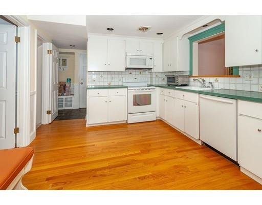28 Constitution Road Lexington, MA 02421 - Photo 13 of 25 a kitchen with stainless steel appliances granite countertop a stove a sink and white cabinets