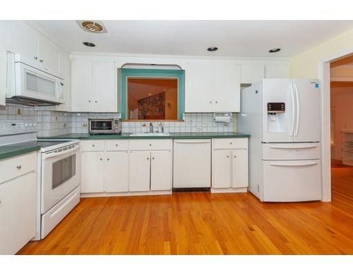 28 Constitution Road Lexington, MA 02421 - Photo 3 of 25 a kitchen with stainless steel appliances a sink cabinets and wooden floor