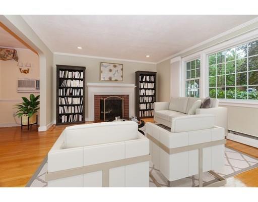 28 Constitution Road Lexington, MA 02421 - Photo 5 of 25 a living room with furniture a fireplace and a large window