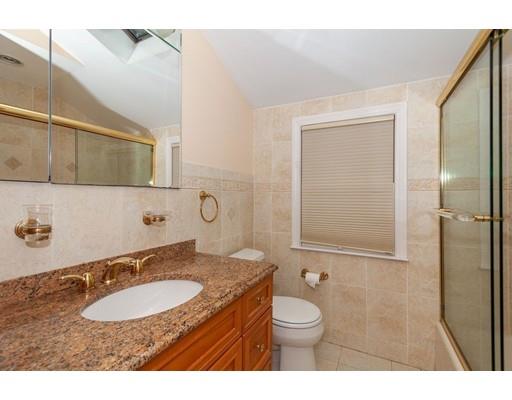 28 Constitution Road Lexington, MA 02421 - Photo 6 of 25 a bathroom with a granite countertop sink and a mirror