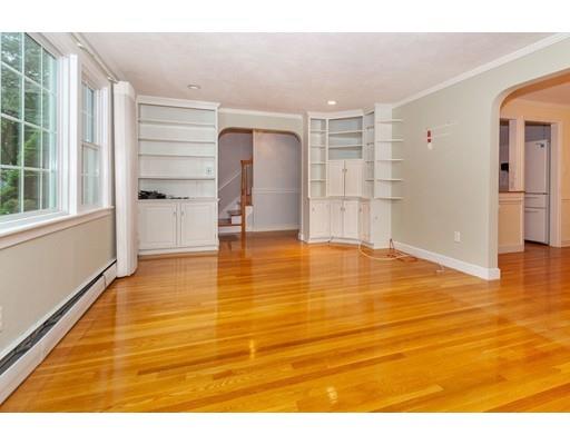 28 Constitution Road Lexington, MA 02421 - Photo 9 of 25 a view of empty room with wooden floor and windows