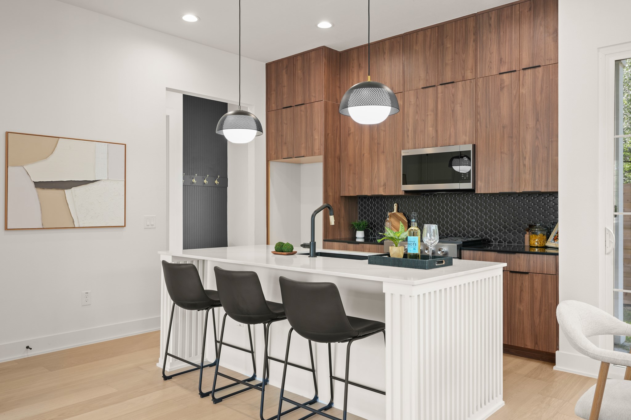 601 Vermont Road, Unit 2 Austin, TX 78702 - Photo 7 of 31 Culinary excellence awaits in this well-appointed kitchen, showcasing sleek cabinetry and a convenient island for gathering.