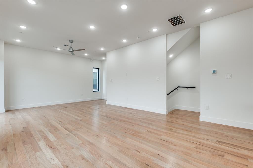 2607 Calvin Street, Unit 3 Dallas, TX 75204 - Photo 11 of 26 a view of empty room with wooden floor and fan