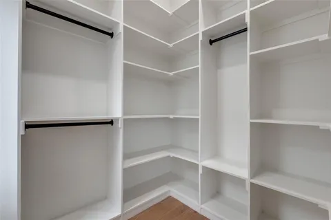 a view of an empty walk in closet
