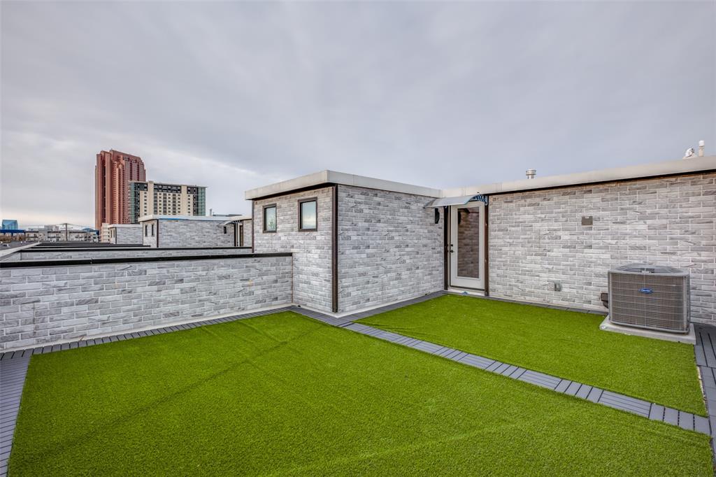 2607 Calvin Street, Unit 3 Dallas, TX 75204 - Photo 24 of 26 a view of a backyard with a garden