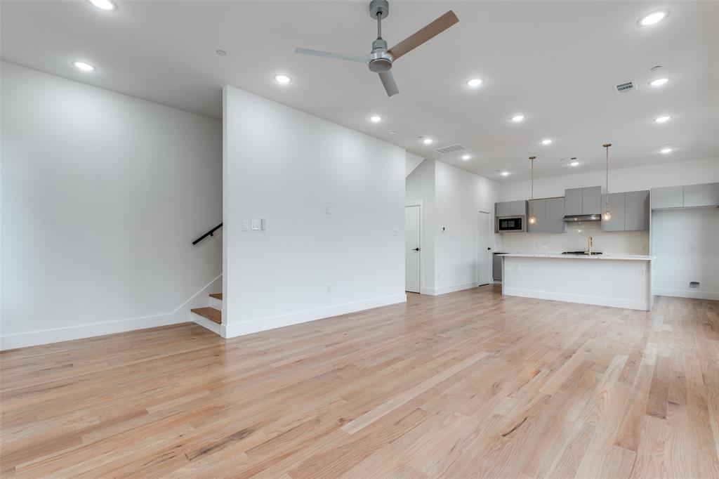 2607 Calvin Street, Unit 3 Dallas, TX 75204 - Photo 4 of 26 a view of a kitchen with a sink and a refrigerator