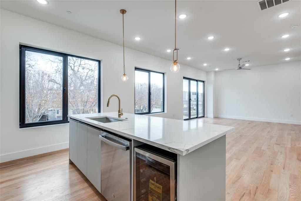 2607 Calvin Street, Unit 3 Dallas, TX 75204 - Photo 9 of 26 a kitchen with counter top a sink and dishwasher