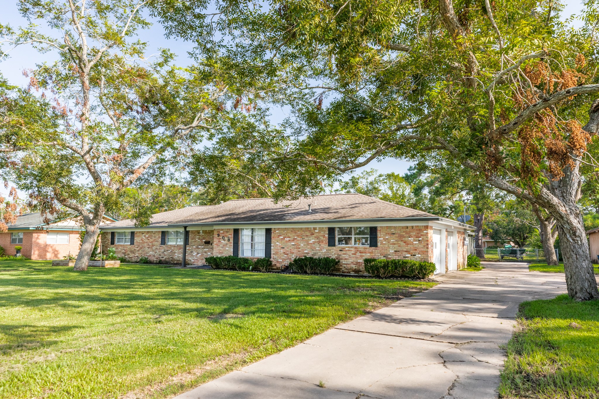908 West Mulberry Street Angleton, TX 77515 - Photo 3 of 22 a front view of a house with a yard
