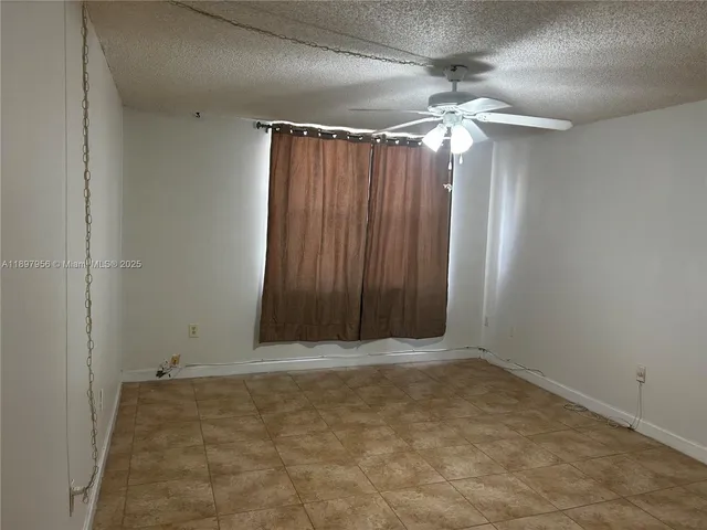 a bathroom with a shower and a toilet