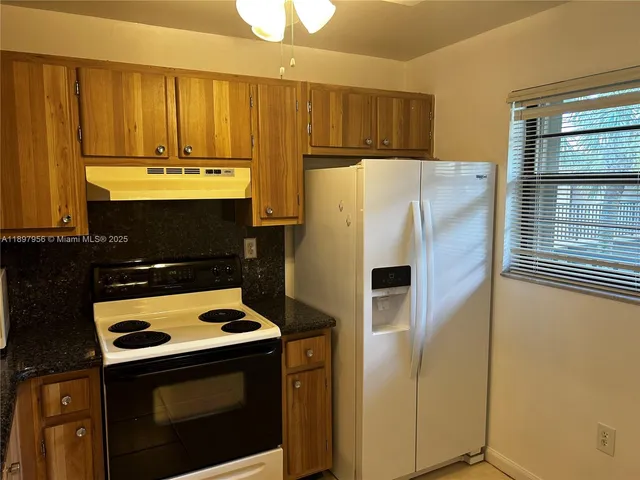 a view of a room that has a large window