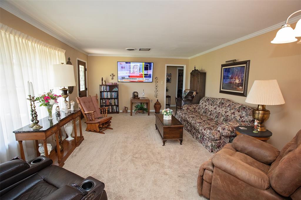 914 Fairview Street Graham, TX 76450 - Photo 2 of 17 a living room with furniture and a flat screen tv
