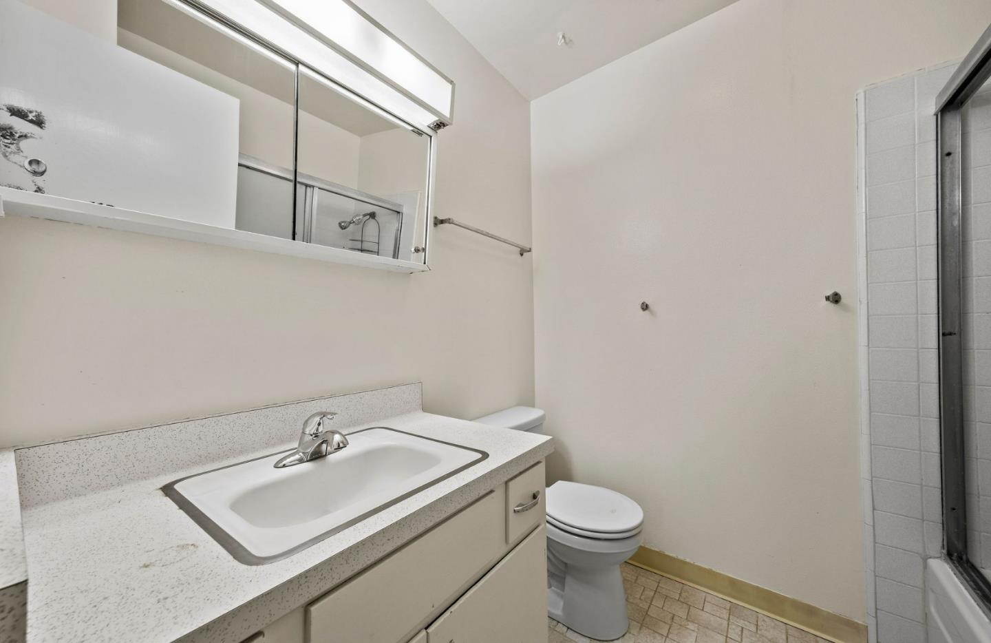 620 Masonic Way Belmont, CA 94002 - Photo 5 of 8 a bathroom with a sink toilet and vanity