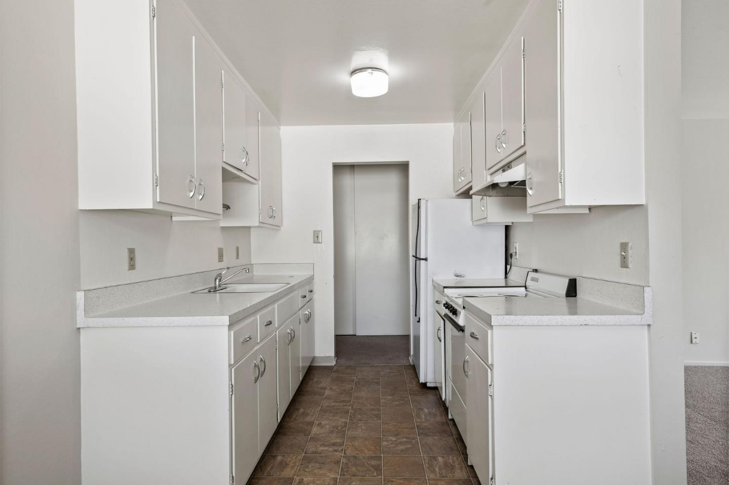 620 Masonic Way Belmont, CA 94002 - Photo 6 of 8 a kitchen with stainless steel appliances granite countertop a sink stove and cabinets