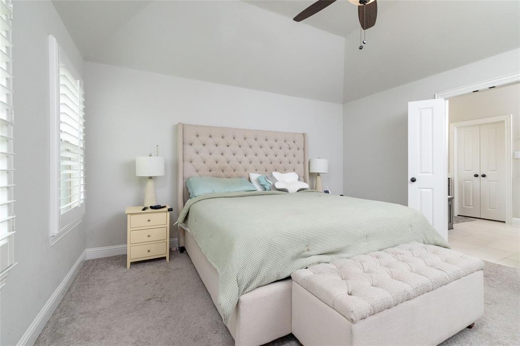 4045 Grove Valley Road Midlothian, TX 76065 - Photo 22 of 34 Bedroom featuring lofted ceiling, a ceiling fan, and light carpet