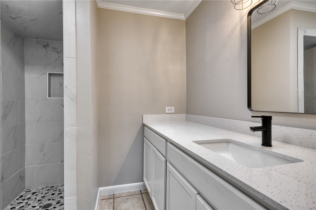 1212 Ridgefield Circle South College Station, TX 77840 - Photo 17 of 23 a bathroom with a sink and a mirror