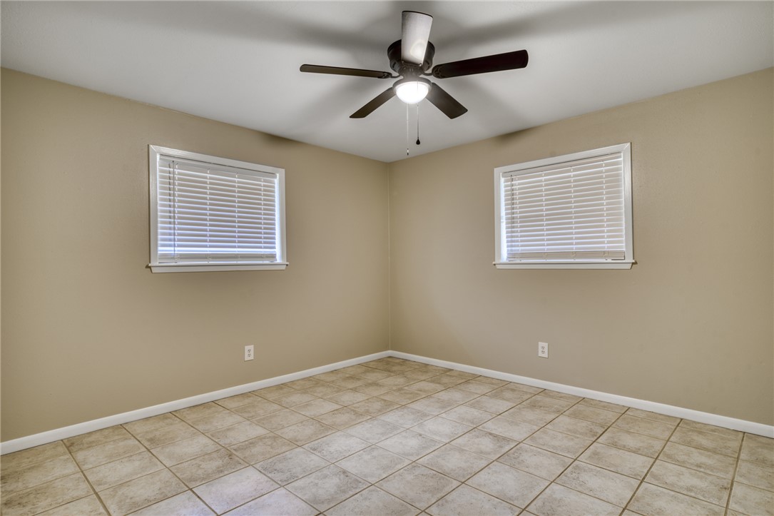 1212 Ridgefield Circle South College Station, TX 77840 - Photo 18 of 23 a view of an empty room with windows