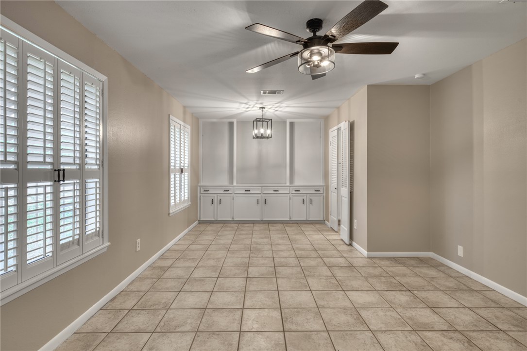 1212 Ridgefield Circle South College Station, TX 77840 - Photo 5 of 23 a view of an empty room with a window