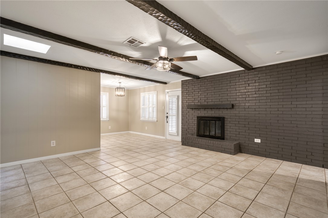 1212 Ridgefield Circle South College Station, TX 77840 - Photo 9 of 23 a view of an empty room with a fireplace