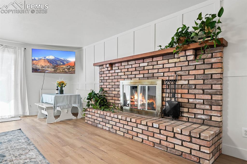 1225 Montezuma Road Colorado Springs, CO 80920 - Photo 23 of 44 fireplace, and a decorative wall