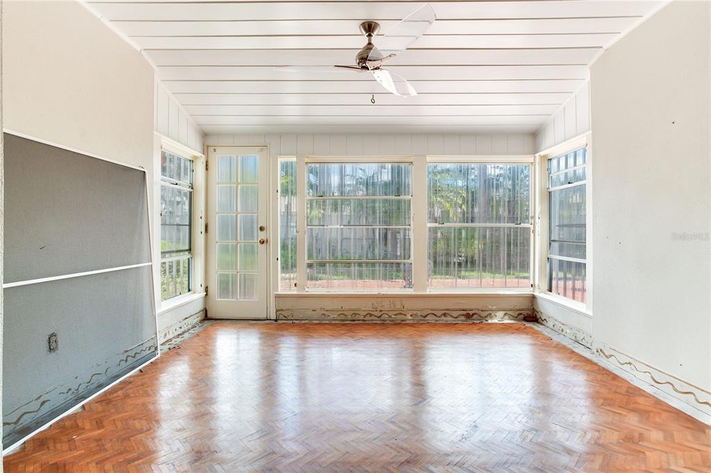 16107 Gulf Boulevard Redington Beach, FL 33708 - Photo 18 of 50 a view of empty room with wooden floor and fan