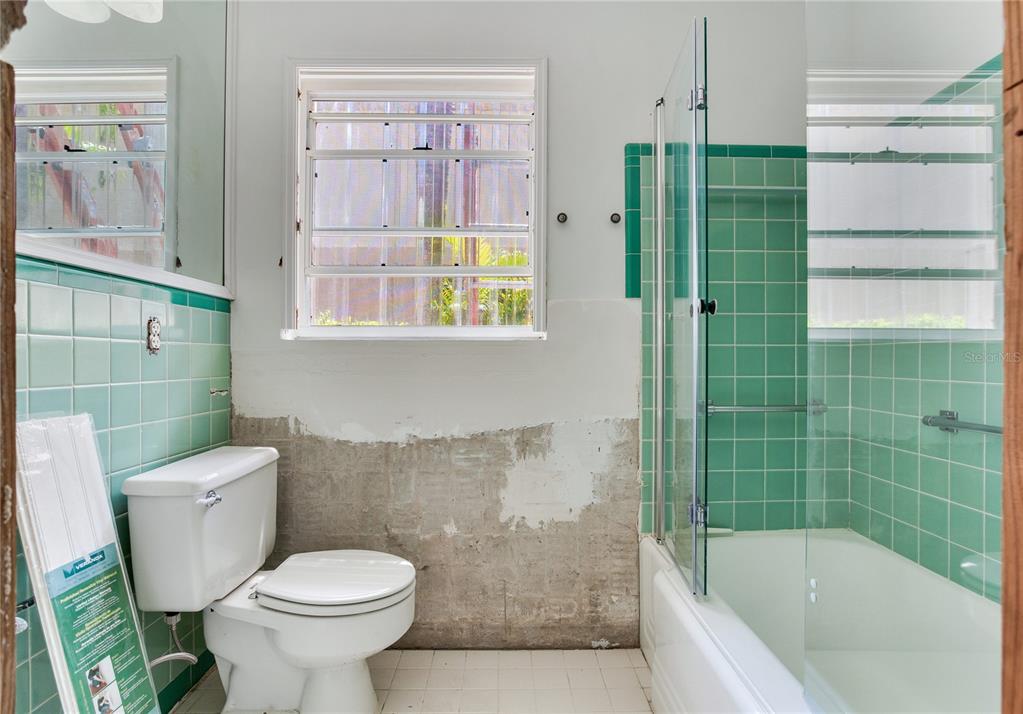 16107 Gulf Boulevard Redington Beach, FL 33708 - Photo 35 of 50 a bathroom with a shower and a toilet