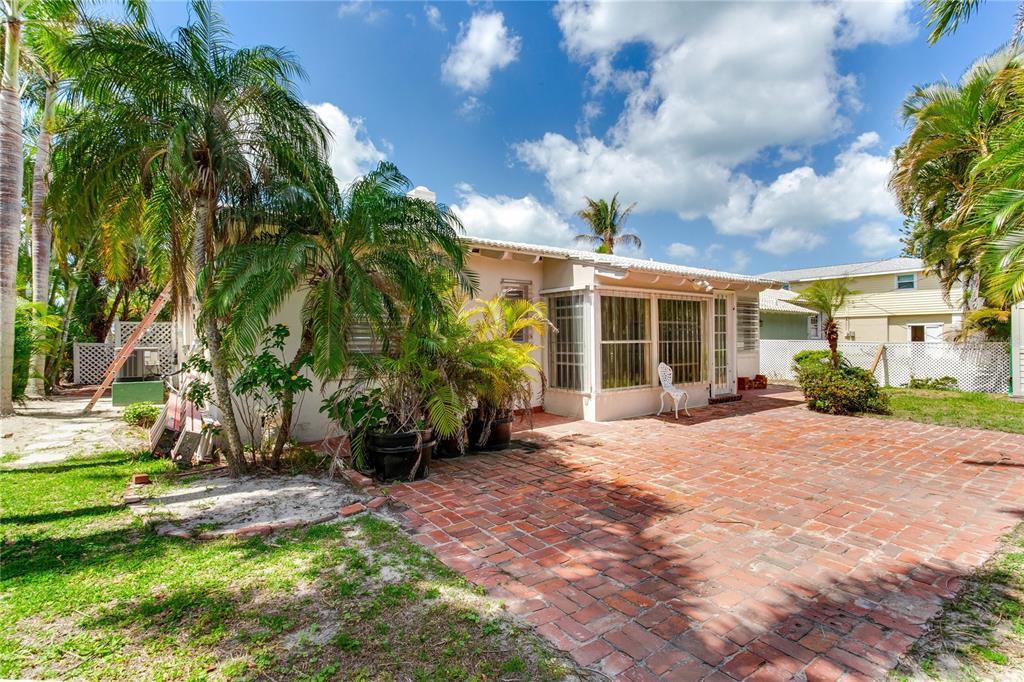 16107 Gulf Boulevard Redington Beach, FL 33708 - Photo 37 of 50 a view of a house with backyard and sitting area