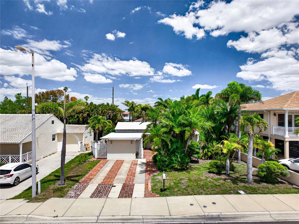16107 Gulf Boulevard Redington Beach, FL 33708 - Photo 40 of 50 a view of a house with a garden
