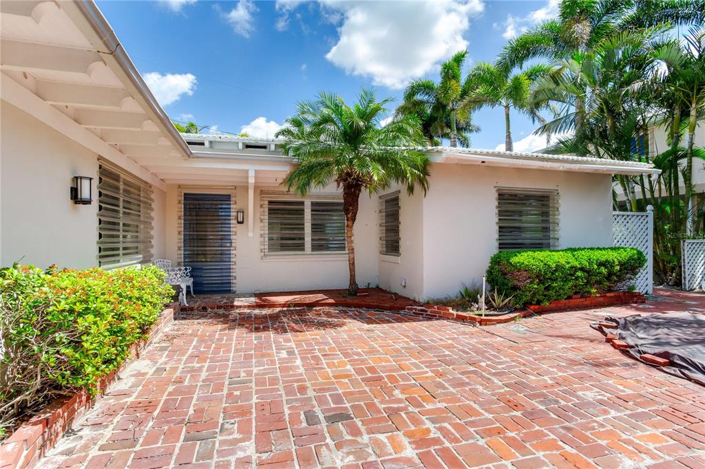 16107 Gulf Boulevard Redington Beach, FL 33708 - Photo 7 of 50 a front view of a house with a yard
