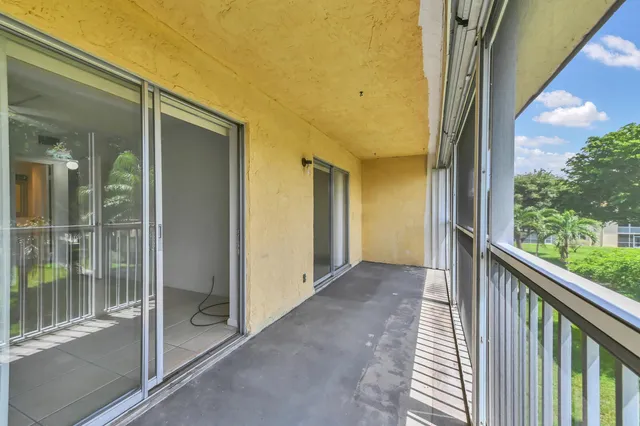 a view of a glass door and the balcony