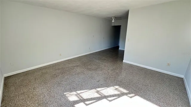a view of a hallway with closet and a hallway