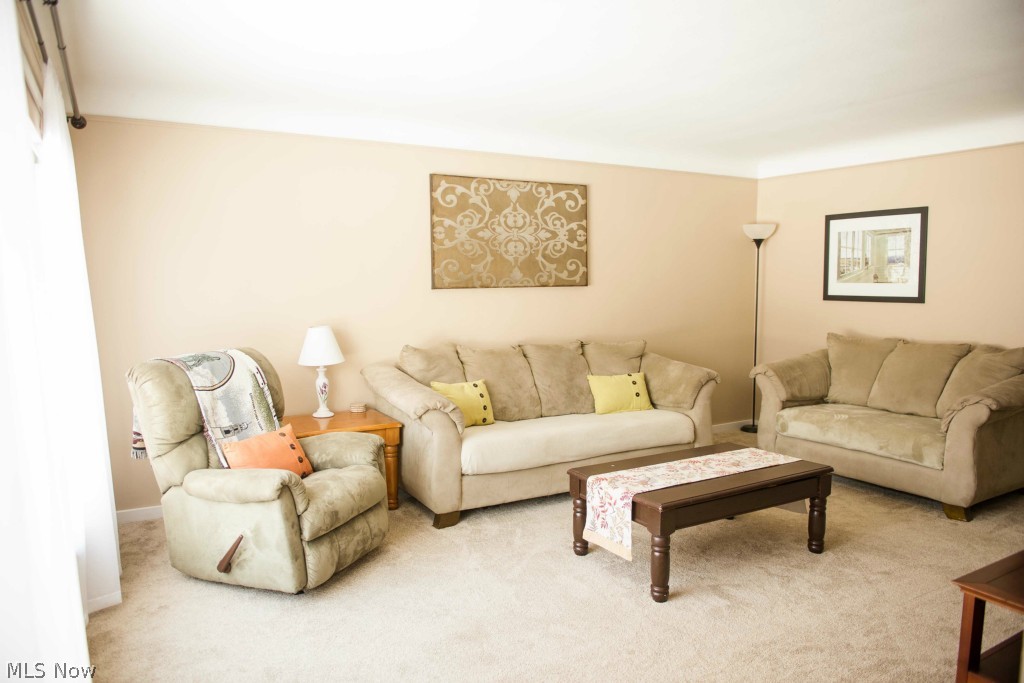1267 Roland Road Lyndhurst, OH 44124 - Photo 2 of 24 The living room boasts cove ceiling and a huge picture window.