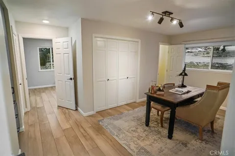 a view of a room that has a table and chairs in it