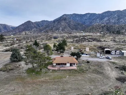 an aerial view of houses with city view