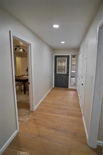 an empty room with closet and a bathroom