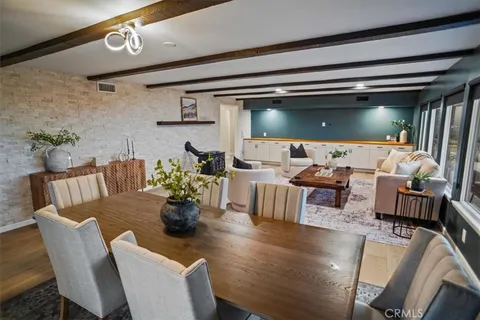 a dining room with furniture and a chandelier