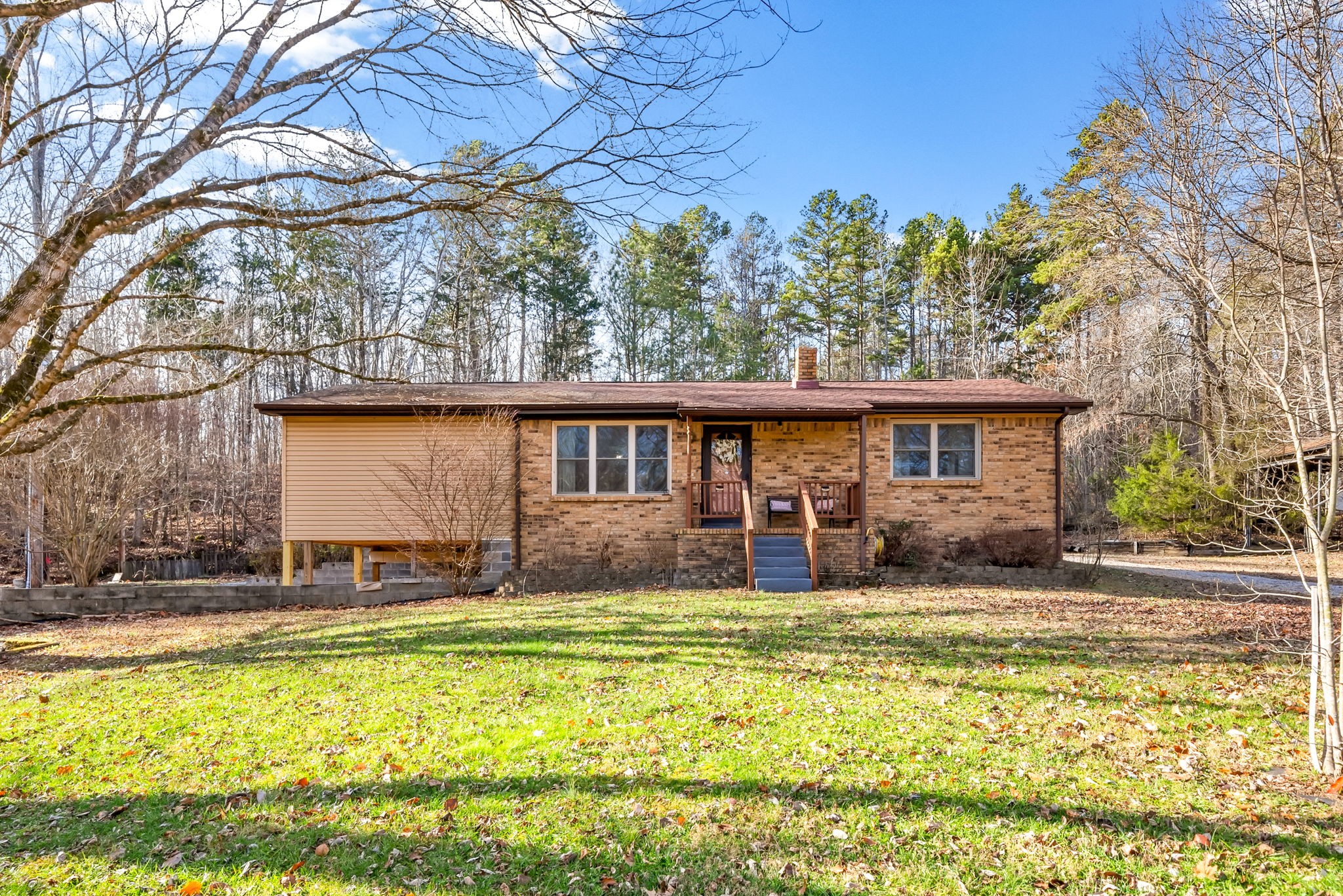 160 Terrapin Run Road Dover, TN 37058 - Photo 1 of 37 a front view of house with yard and trees in the background
