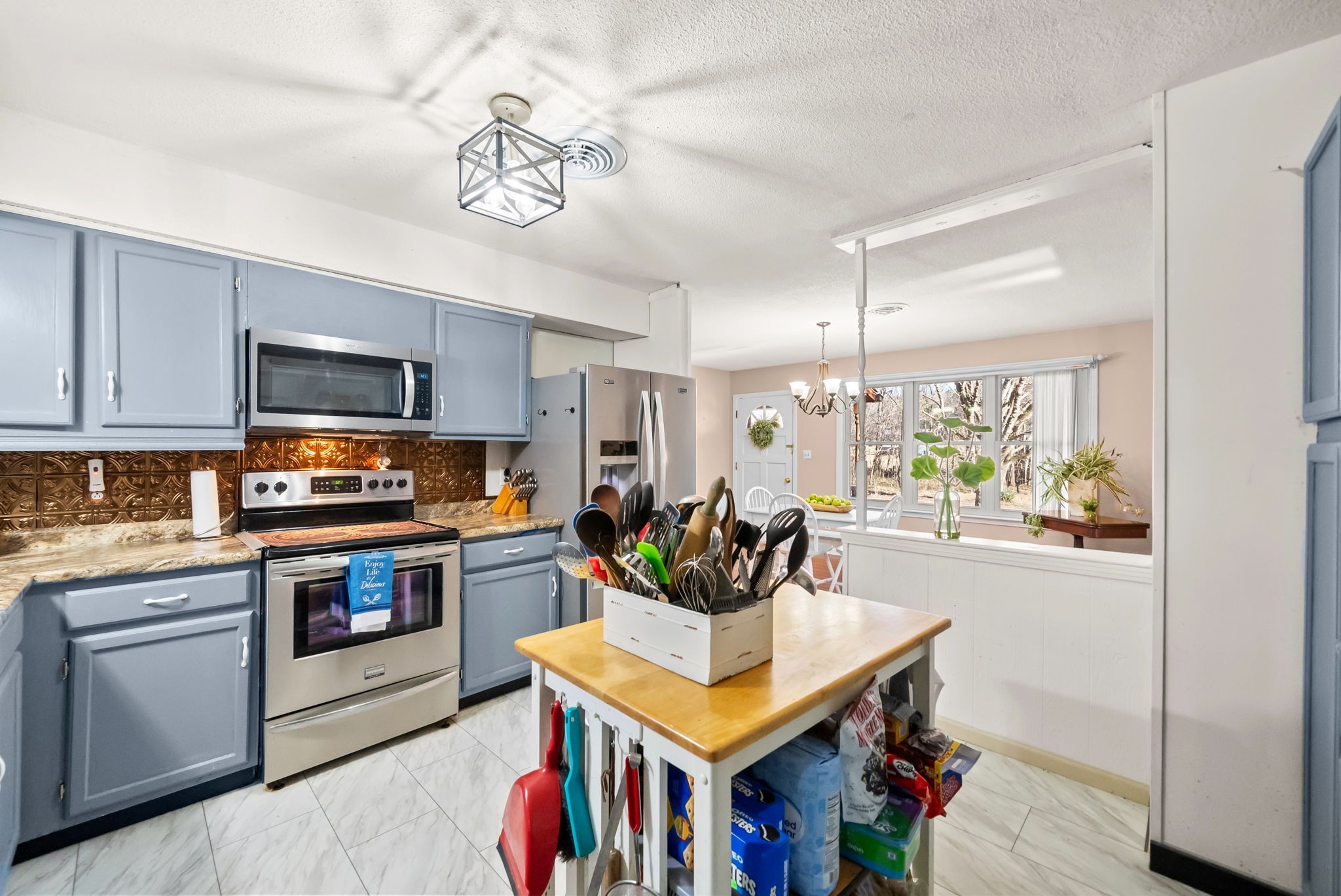 160 Terrapin Run Road Dover, TN 37058 - Photo 11 of 37 a kitchen with stainless steel appliances granite countertop a stove a sink dishwasher and a refrigerator with wooden floor