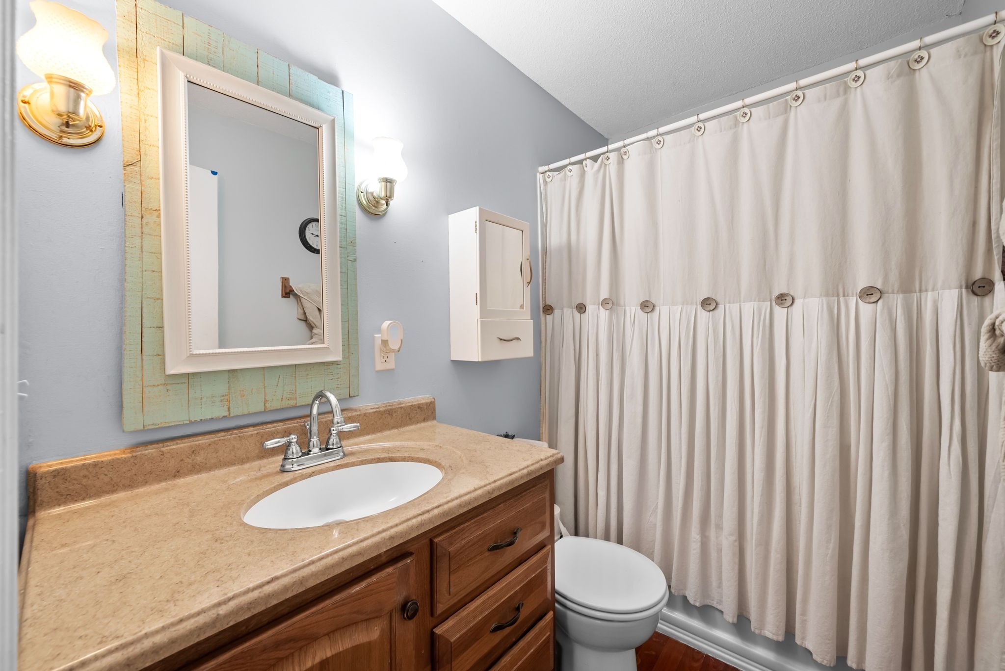 160 Terrapin Run Road Dover, TN 37058 - Photo 17 of 37 a bathroom with a granite countertop sink a toilet and a mirror