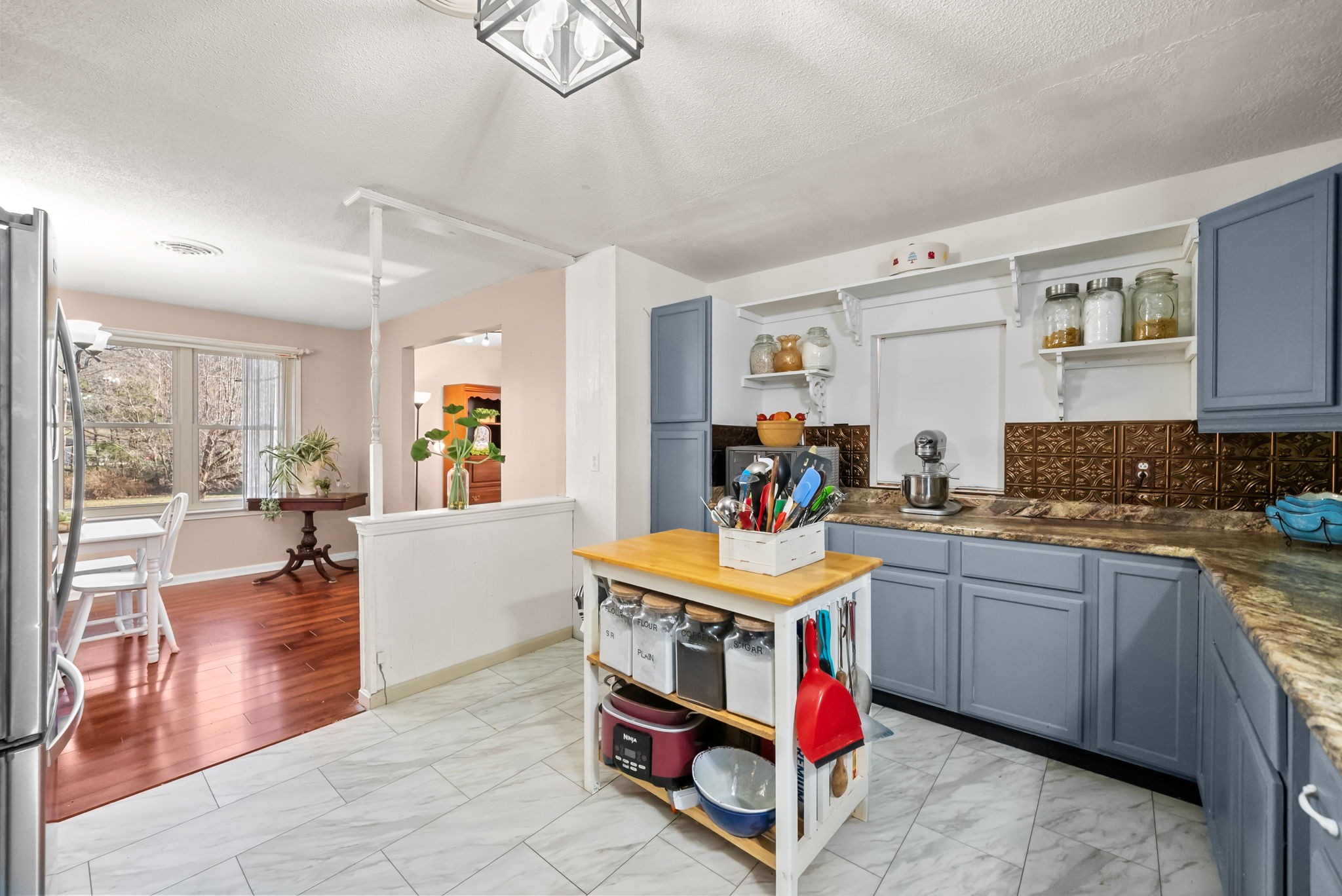 160 Terrapin Run Road Dover, TN 37058 - Photo 10 of 37 a room with stainless steel appliances kitchen island granite countertop a sink and cabinets