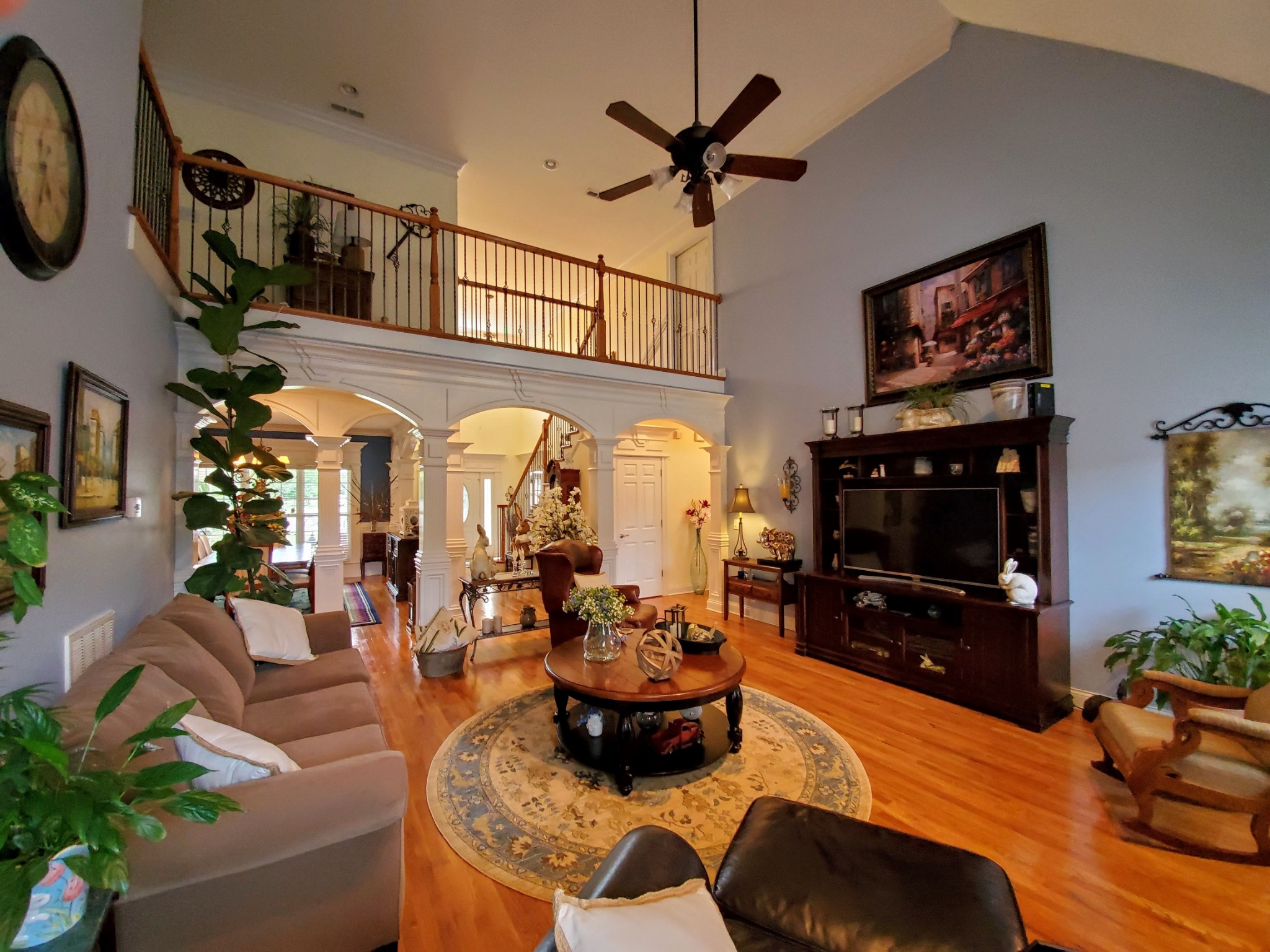 1523 Winterberry Drive Murfreesboro, TN 37130 - Photo 11 of 42 a living room with furniture a flat screen tv and a fireplace