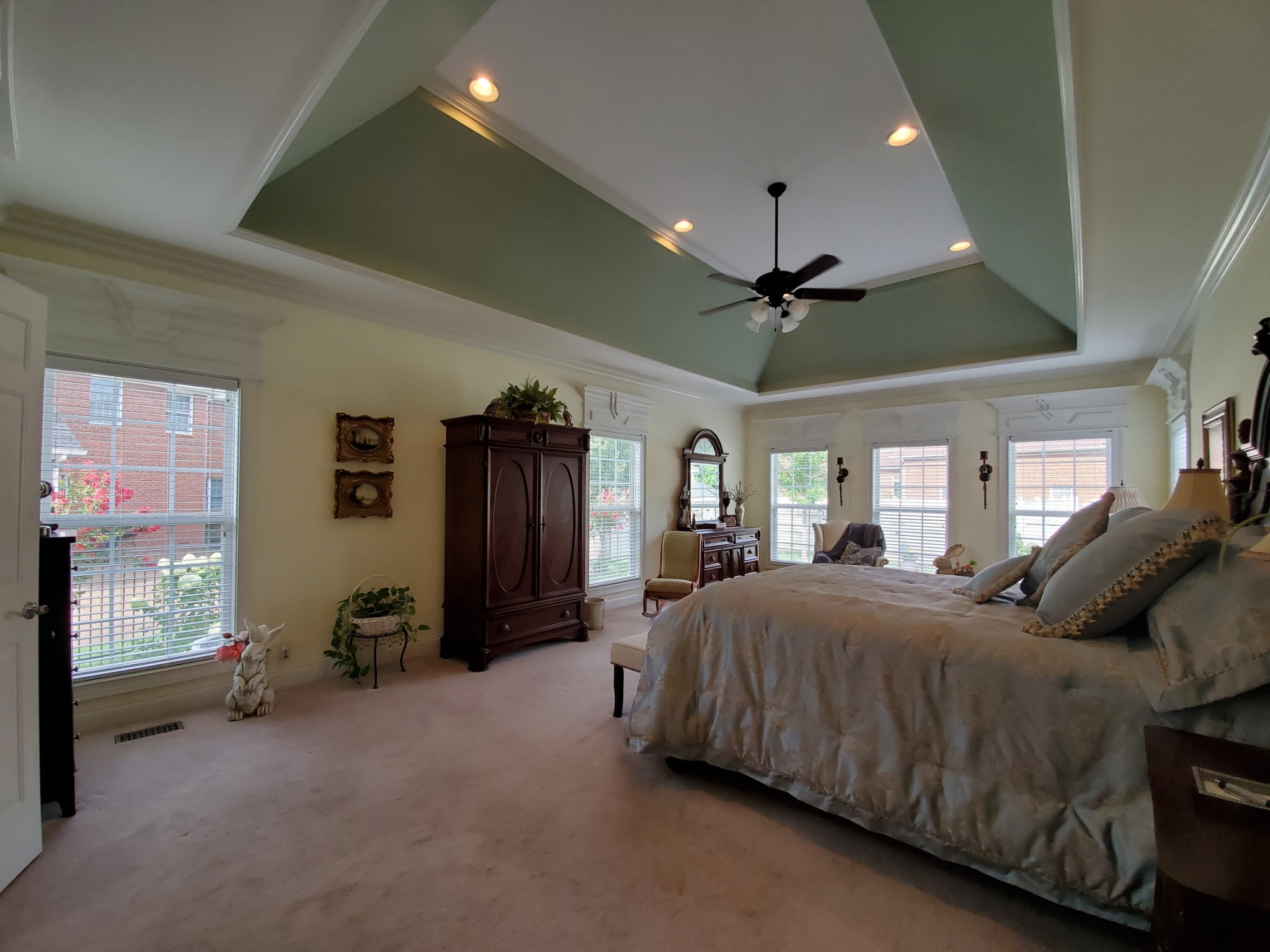 1523 Winterberry Drive Murfreesboro, TN 37130 - Photo 12 of 42 a spacious bedroom with a bed couch and a ceiling fan