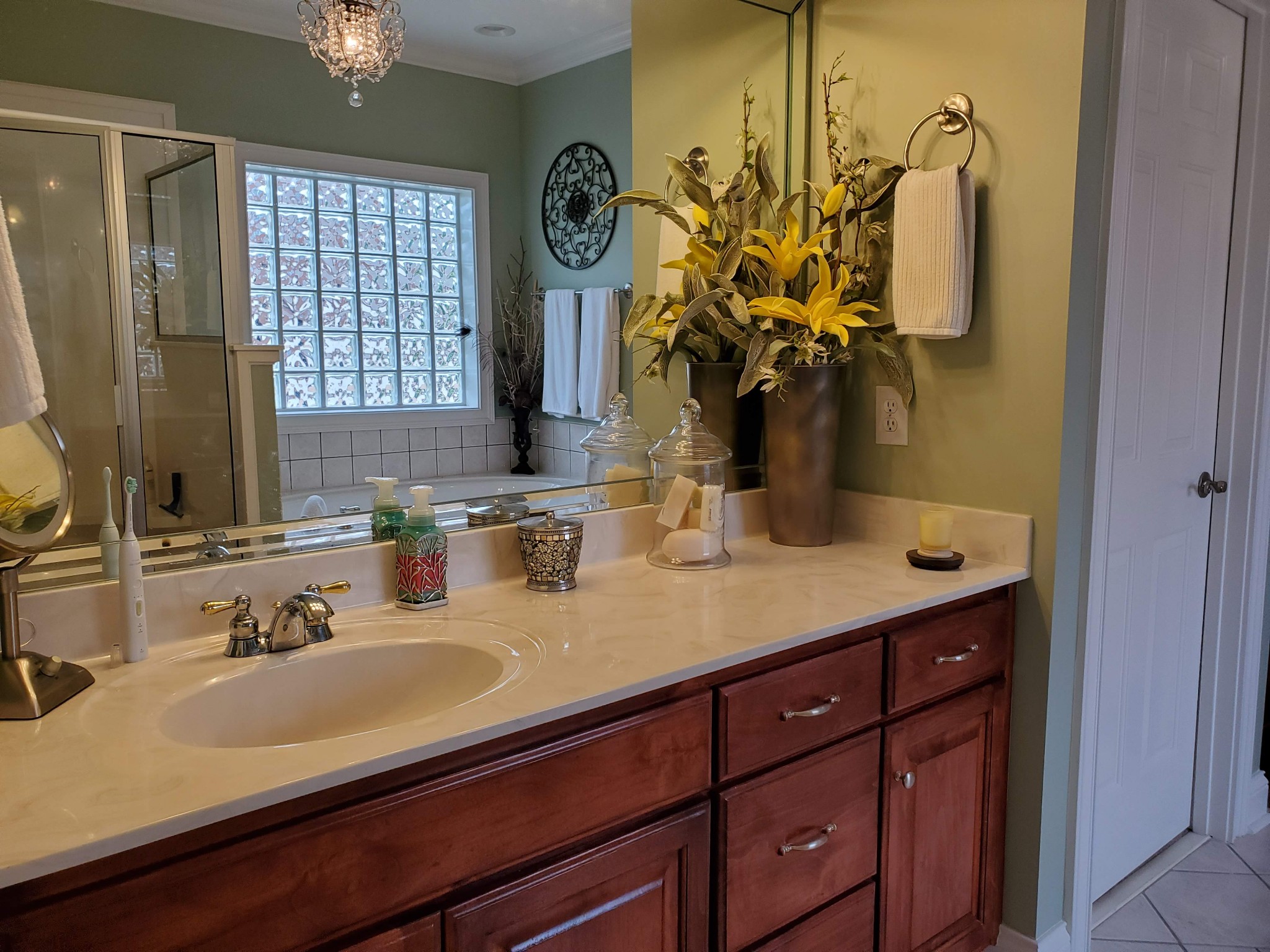 1523 Winterberry Drive Murfreesboro, TN 37130 - Photo 15 of 42 a bathroom with a granite countertop sink a large mirror and a shower