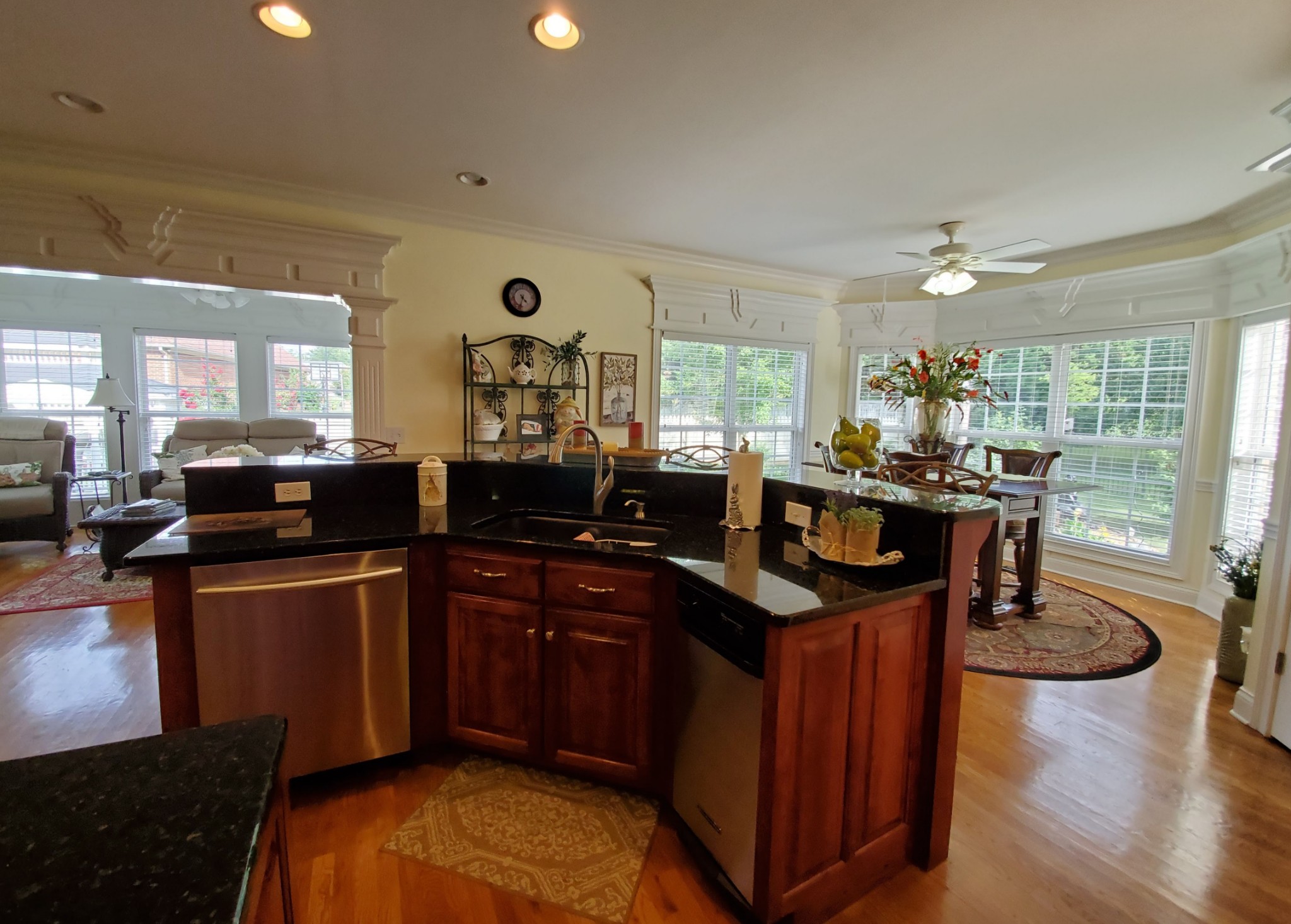 1523 Winterberry Drive Murfreesboro, TN 37130 - Photo 20 of 42 a kitchen with stainless steel appliances granite countertop a sink a stove and a wooden floors