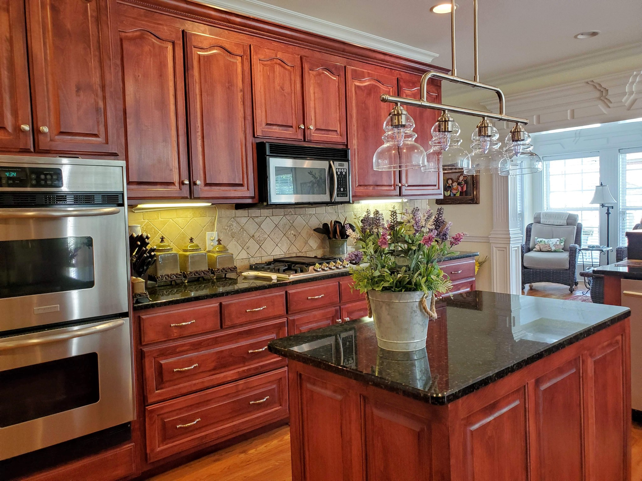 1523 Winterberry Drive Murfreesboro, TN 37130 - Photo 22 of 42 a kitchen with kitchen island granite countertop a sink stainless steel appliances and cabinets