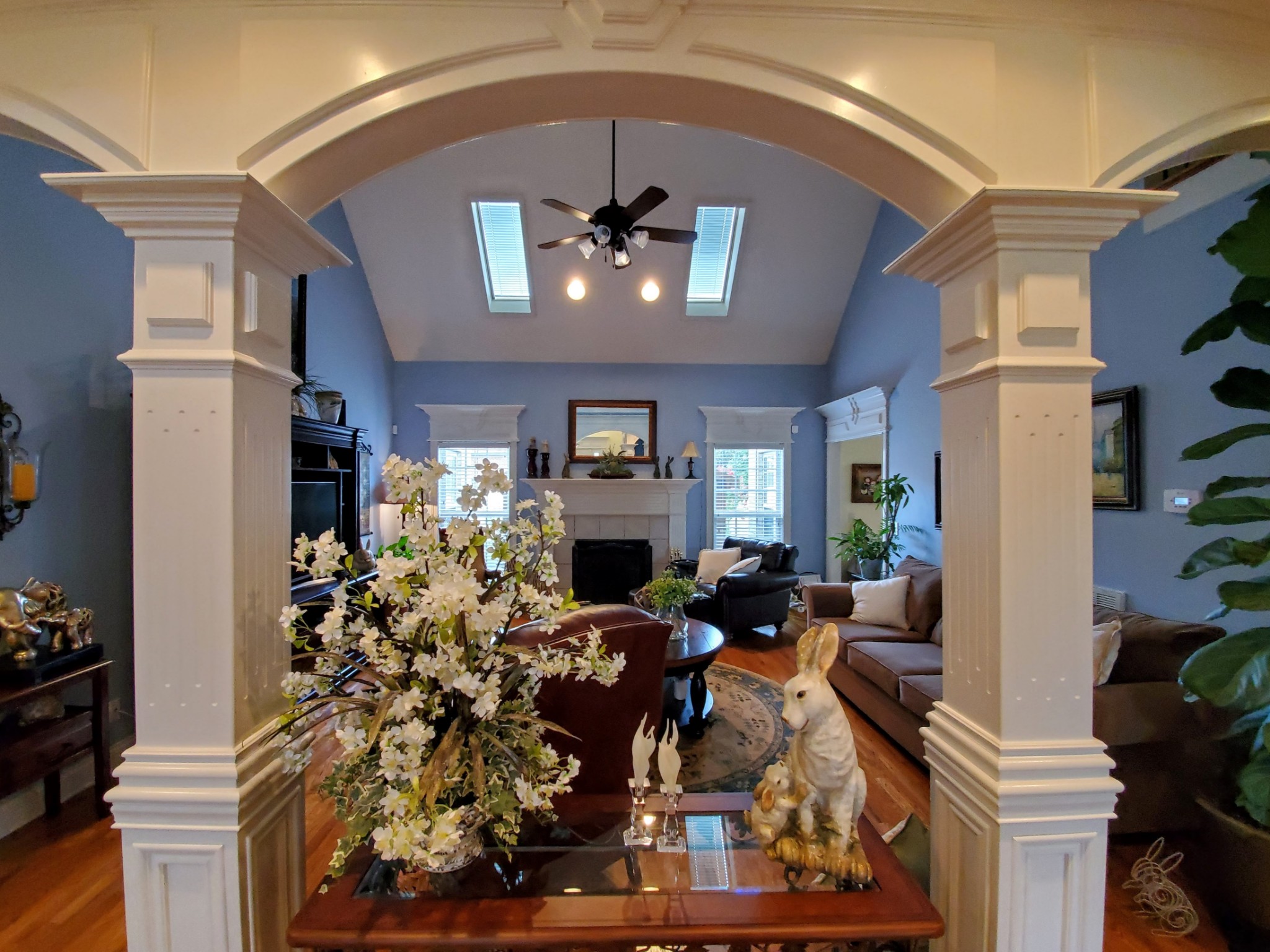 1523 Winterberry Drive Murfreesboro, TN 37130 - Photo 35 of 42 a living room filled with furniture a chandelier and a fireplace