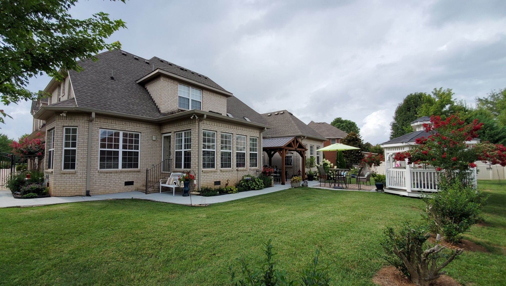 1523 Winterberry Drive Murfreesboro, TN 37130 - Photo 41 of 42 a view of a house with backyard sitting area and garden